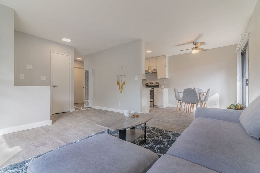 a living room with a couch and a table at The Gates at The Marina Apartments, California, 93933