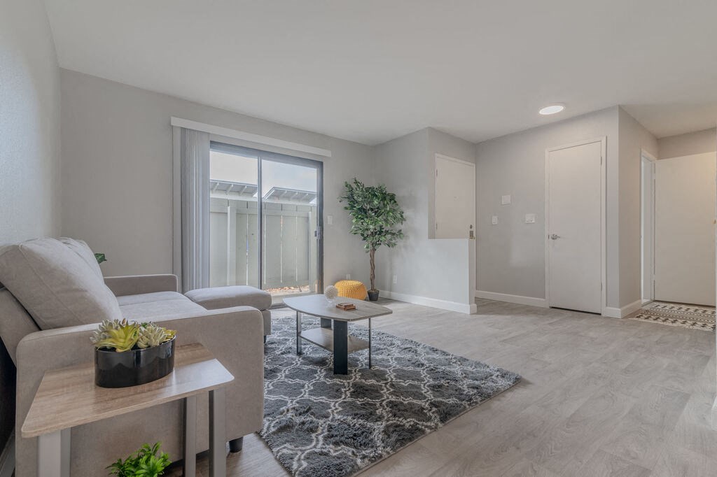 a living room with a coua table at The Gates at The Marina Apartments, Marina California