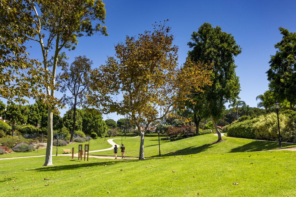 a park with trees and a path in the grass at La Jolla Blue, San Diego