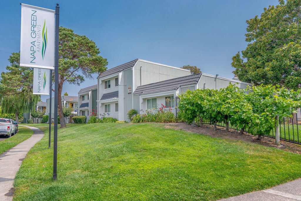 a house with a yard and a sign in front of it at Napa Green Apartments LLC, Napa