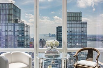 A view of a cityscape from a high-rise building at SKY Apartments, New York 10036