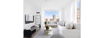 A modern living room with a view of the city skyline.