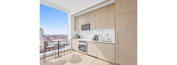 A kitchen with a view of the city.
