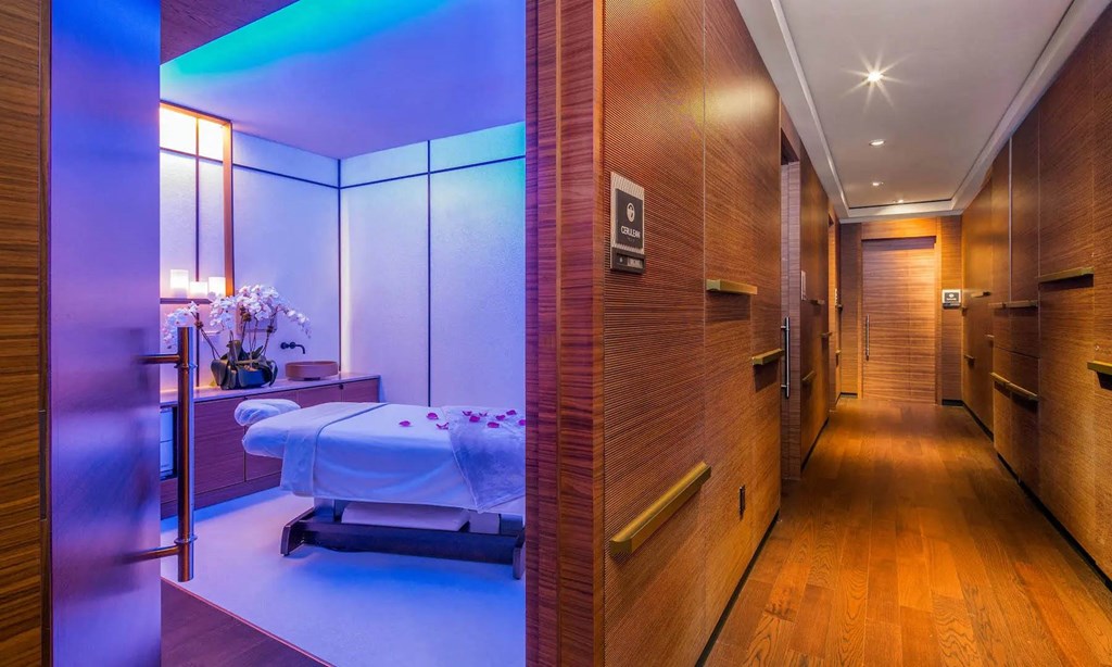 a bedroom with a bed and a closet in a hotel room at SKY Apartments, New York, NY, 10036