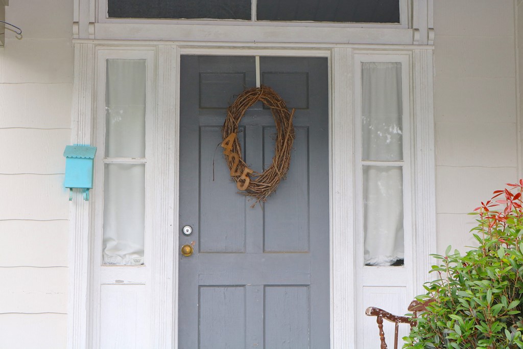 a wreath on the front door of a house