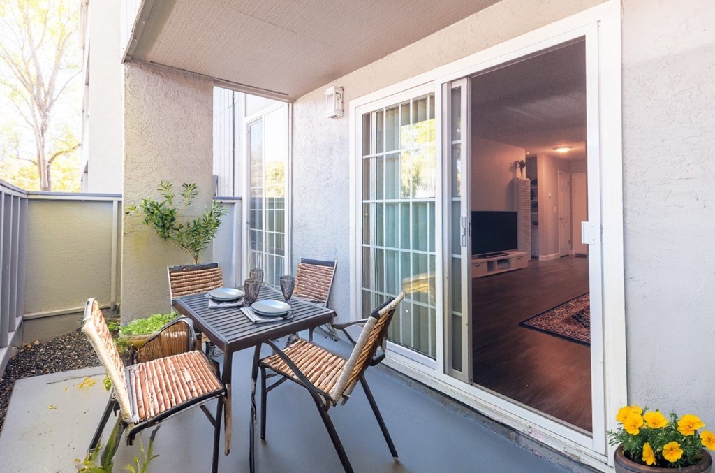 A patio with a table and chairs is shown.