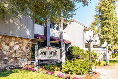 The Sequoyah Apartments sign is in front of a building.