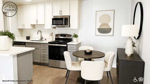 A modern kitchen with white cabinets and a black stove top oven.