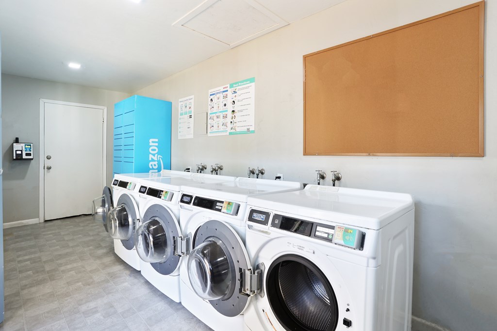 A row of washing machines in a laundromat.