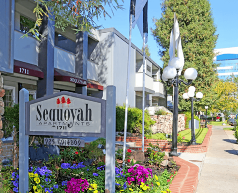 a building with a sign that reads sequoyah apartments