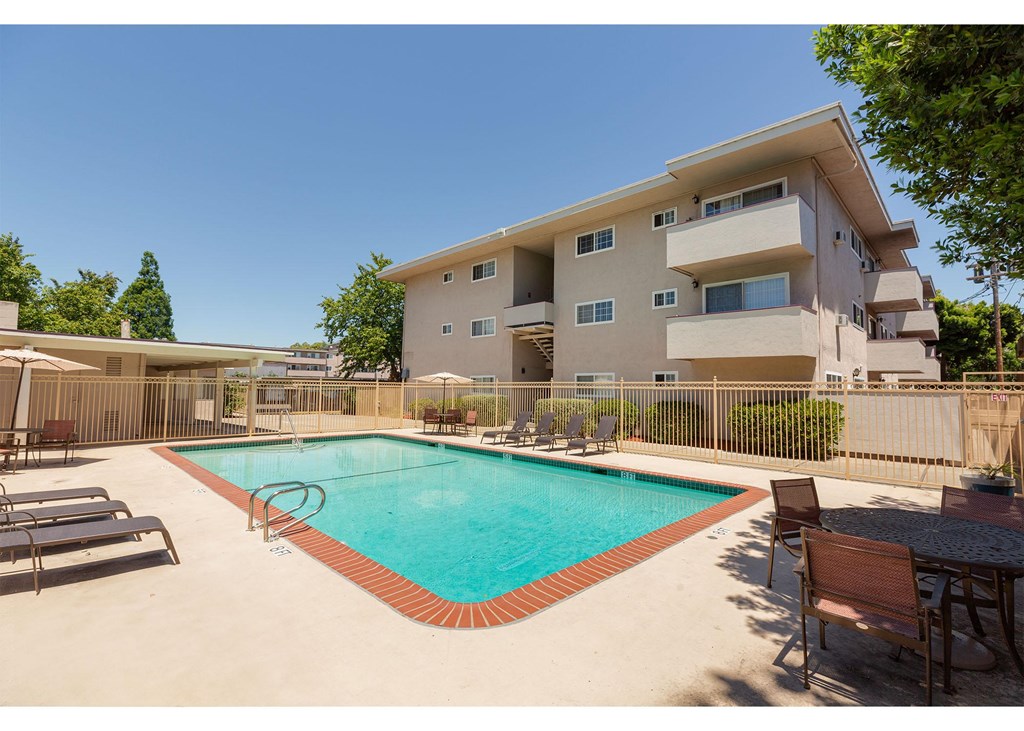 A large house with a pool in the backyard.