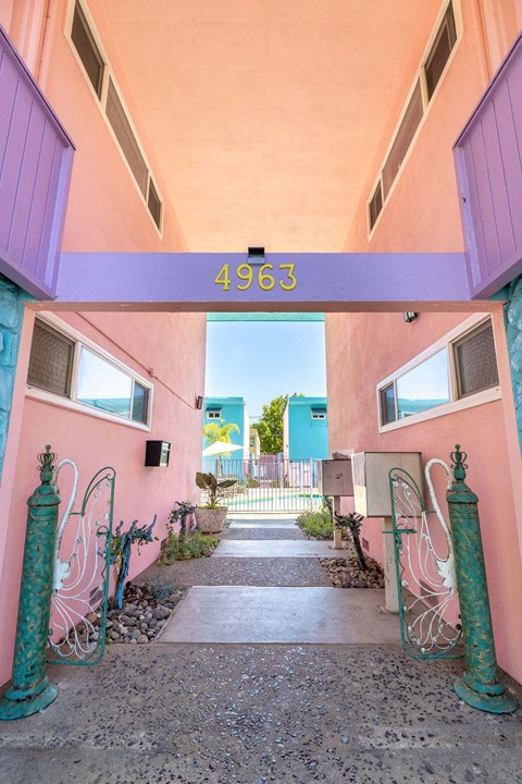 A pink building with a number 4963 on the top.