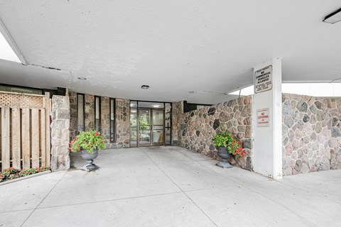 A stone wall with a sign on it.