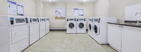 A row of washing machines in a laundromat.