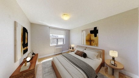 A bedroom with a bed, nightstands, and a painting on the wall.