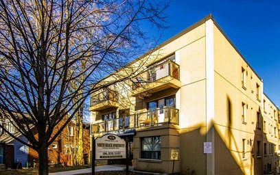 A building with a sign that says "The Westin" in front of it.