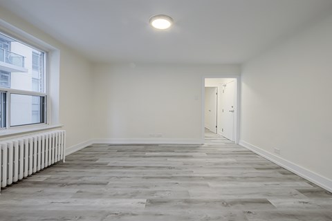 A room with a grey floor and white walls.