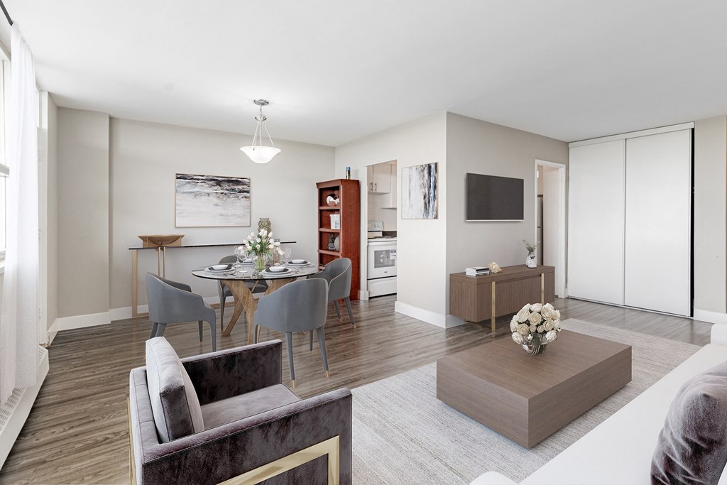 A modern living room with a grey sofa and a wooden coffee table.