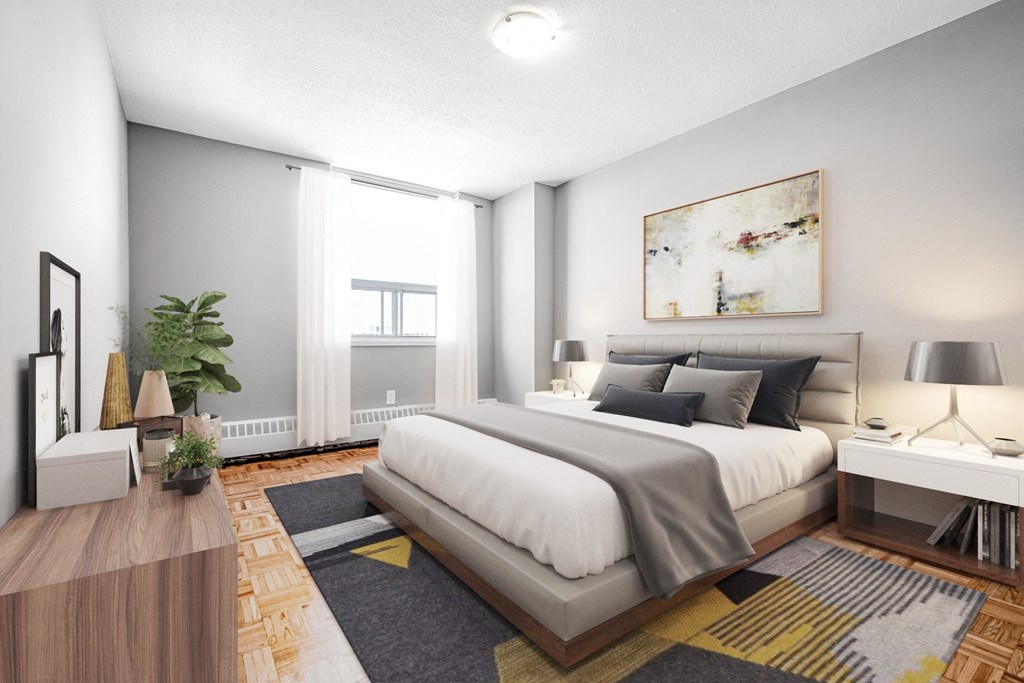 A modern bedroom with a large bed and a painting on the wall.