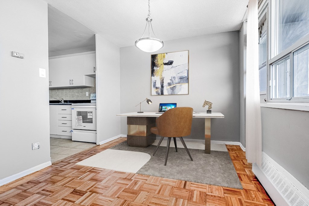 A room with a desk and a chair.