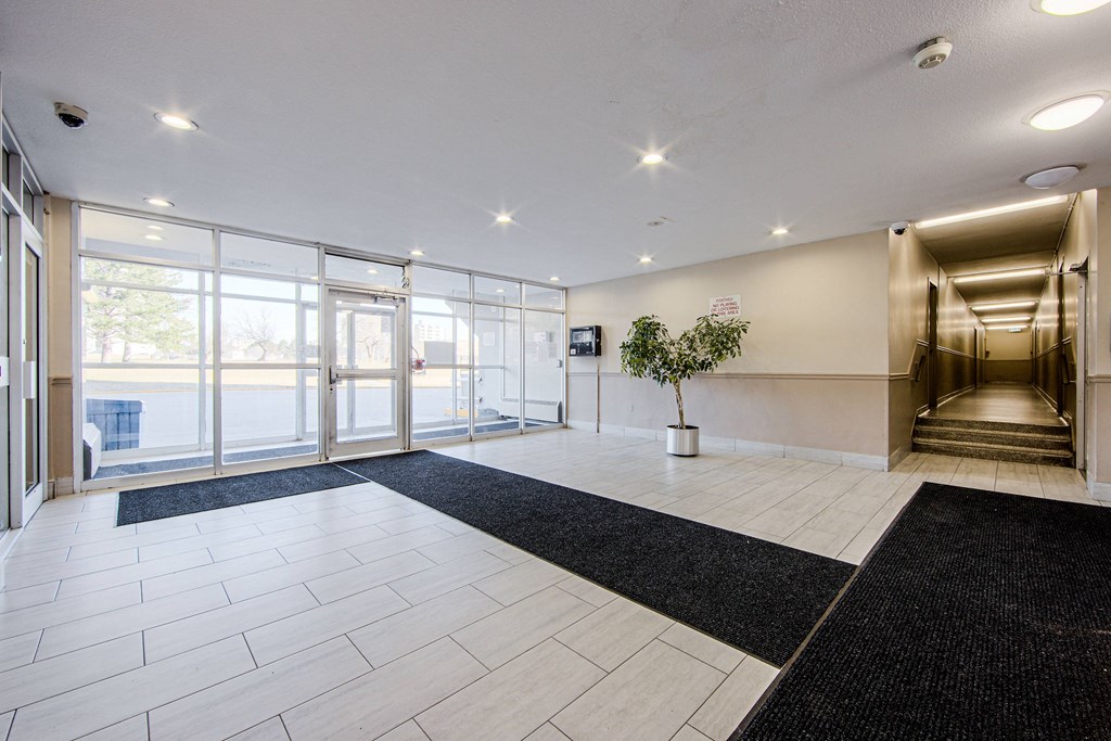the preserve at cardinalioch apartments lobby with staircase and glass doors