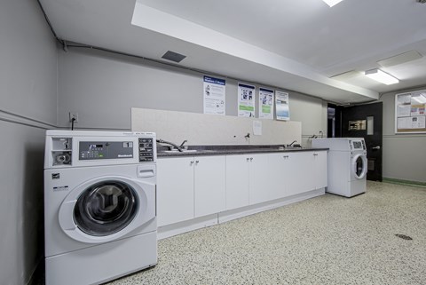 A laundry room with a washing machine and a dryer.