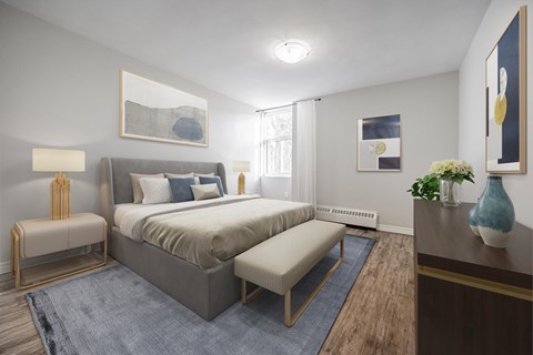 A bedroom with a large bed and a bench.