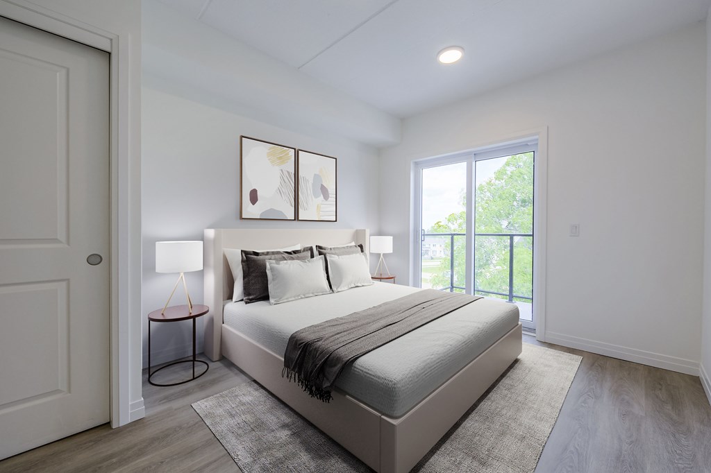A bedroom with a bed, a lamp, and a painting on the wall.