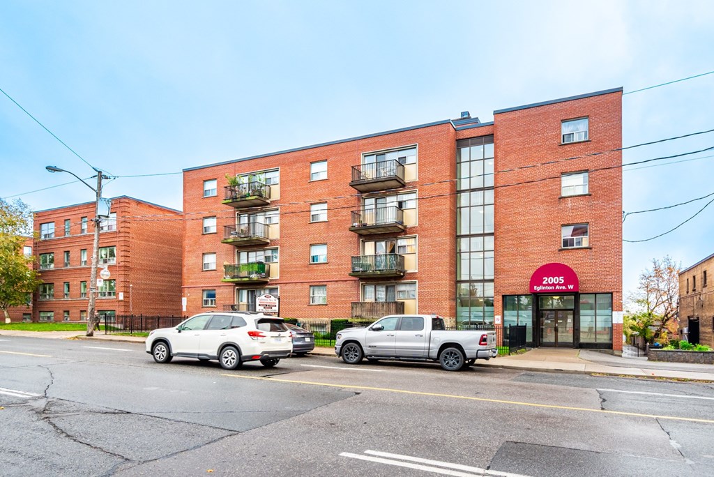 A red brick building with the number 2005 on it.