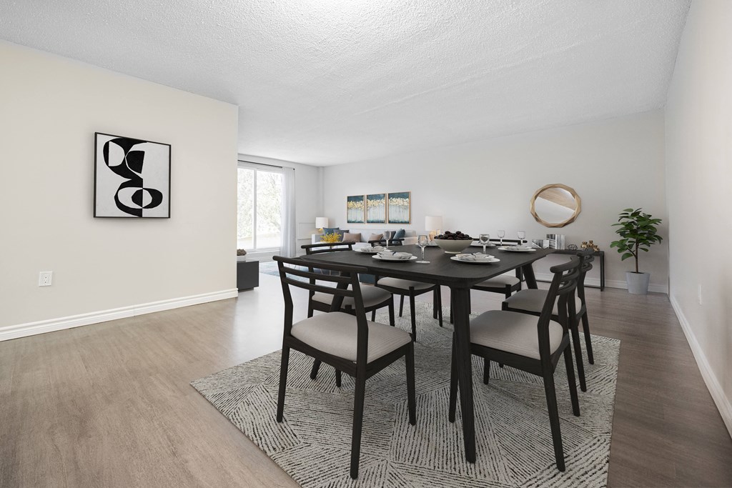A dining room with a table set for six.