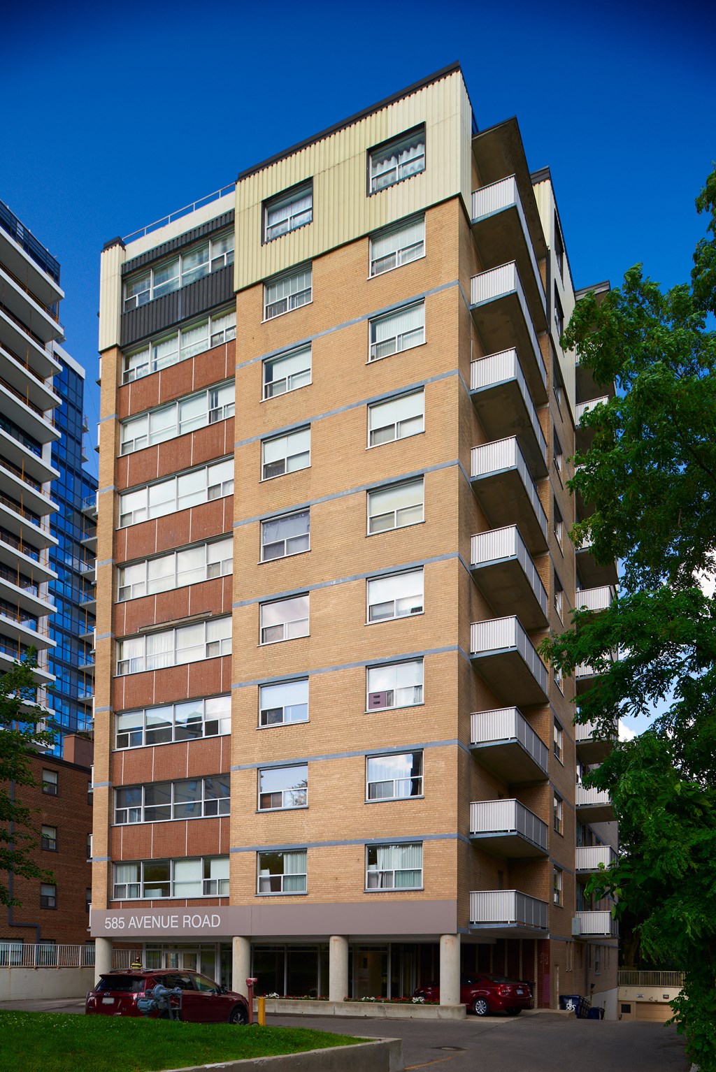 a tall brick building with a blue sky in the background