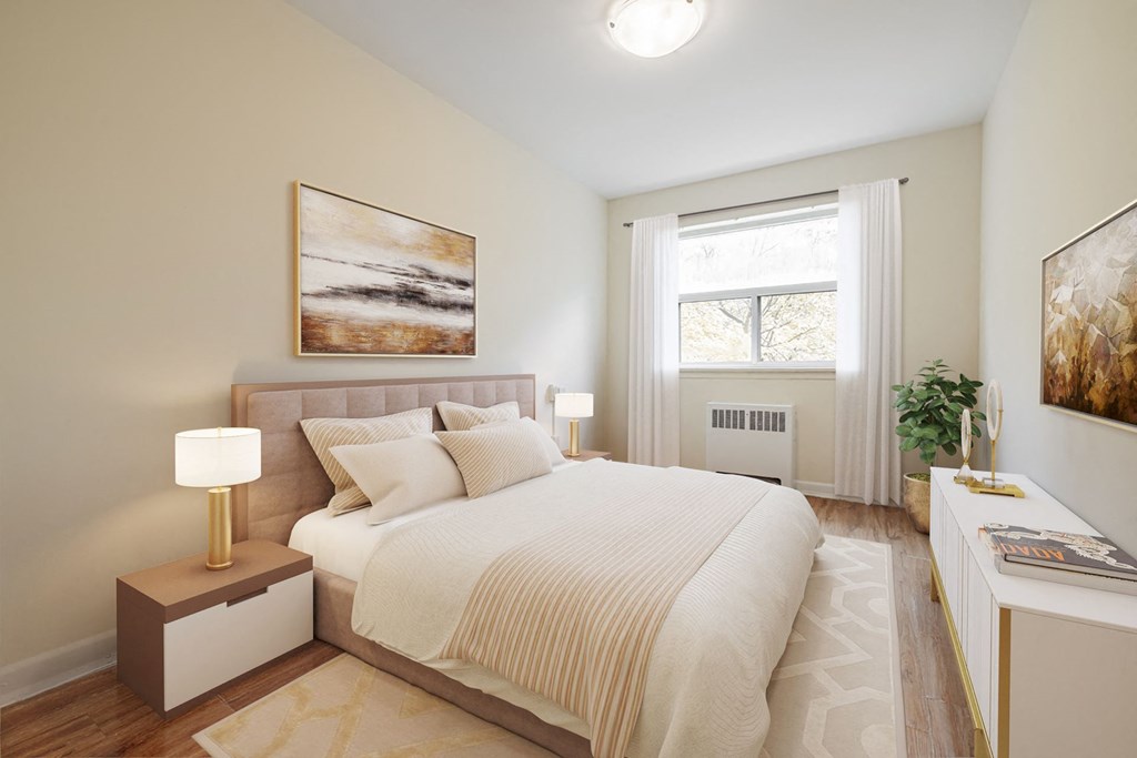 A bedroom with a large bed and a painting on the wall.