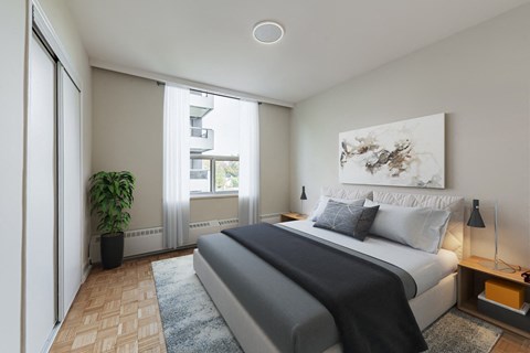 A bedroom with a large bed and a painting on the wall.