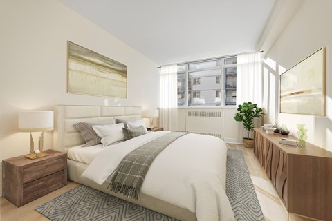 A bedroom with a large bed and a lamp on a side table.