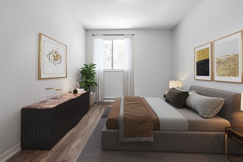 A bedroom with a bed, nightstand, and a plant.