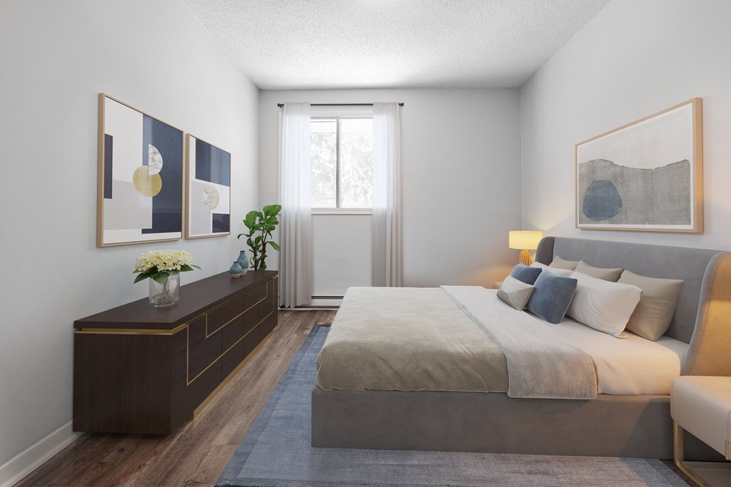 A bedroom with a large bed and a wooden dresser.