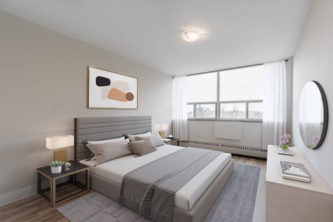 A bedroom with a large bed, a nightstand with a lamp, and a painting on the wall.