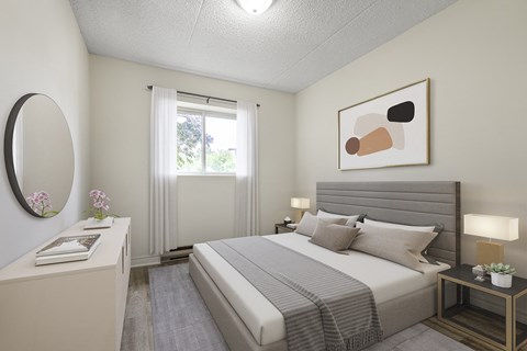 A bedroom with a large bed, a nightstand, and a painting on the wall.