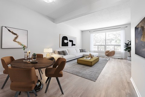 A modern living room with a dining table and chairs.