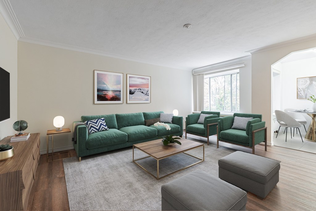 A living room with a green couch and a coffee table.