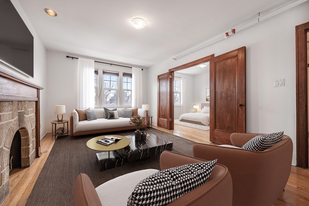 A living room with a fireplace and a couch.