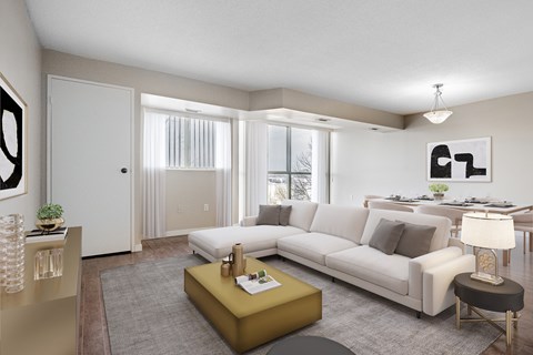 A living room with a white couch, a yellow coffee table, and a painting on the wall.