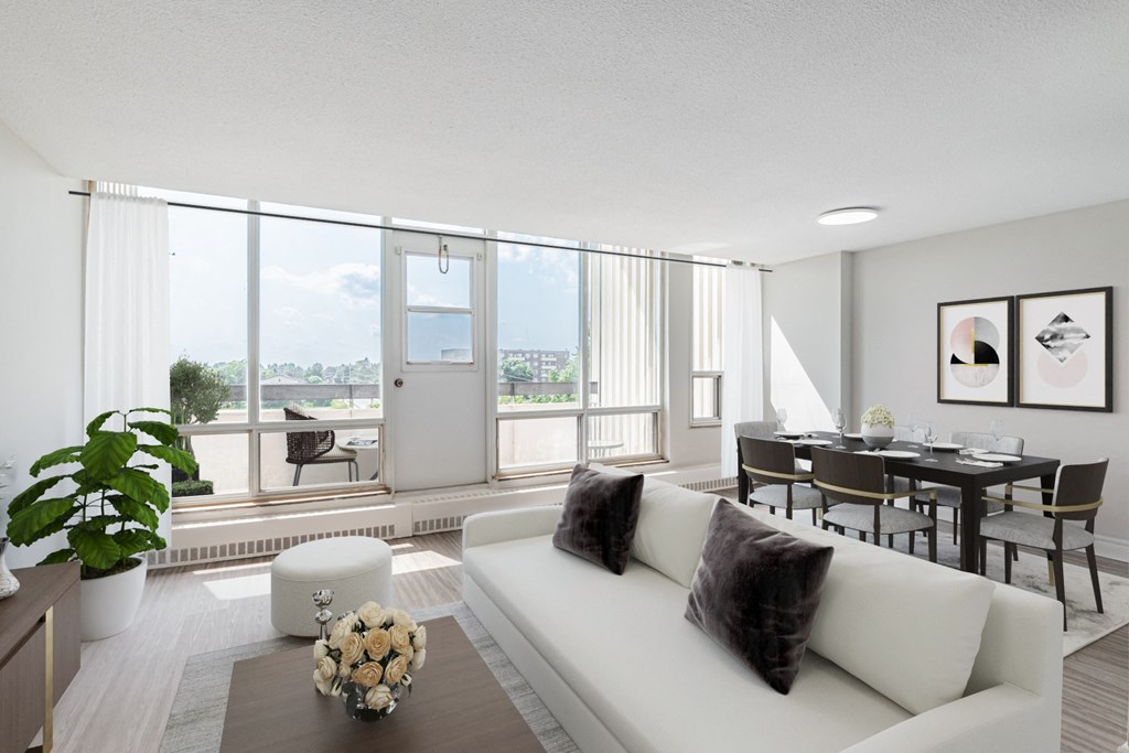 A modern living room with a white sofa and a dining table.