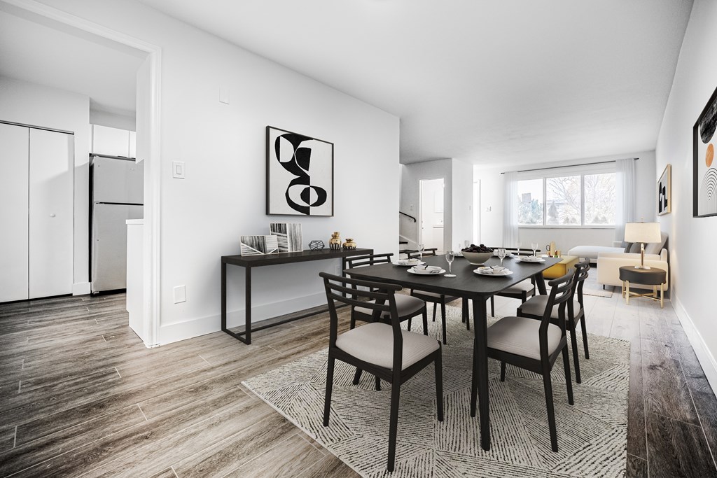 A dining room with a table set for six.