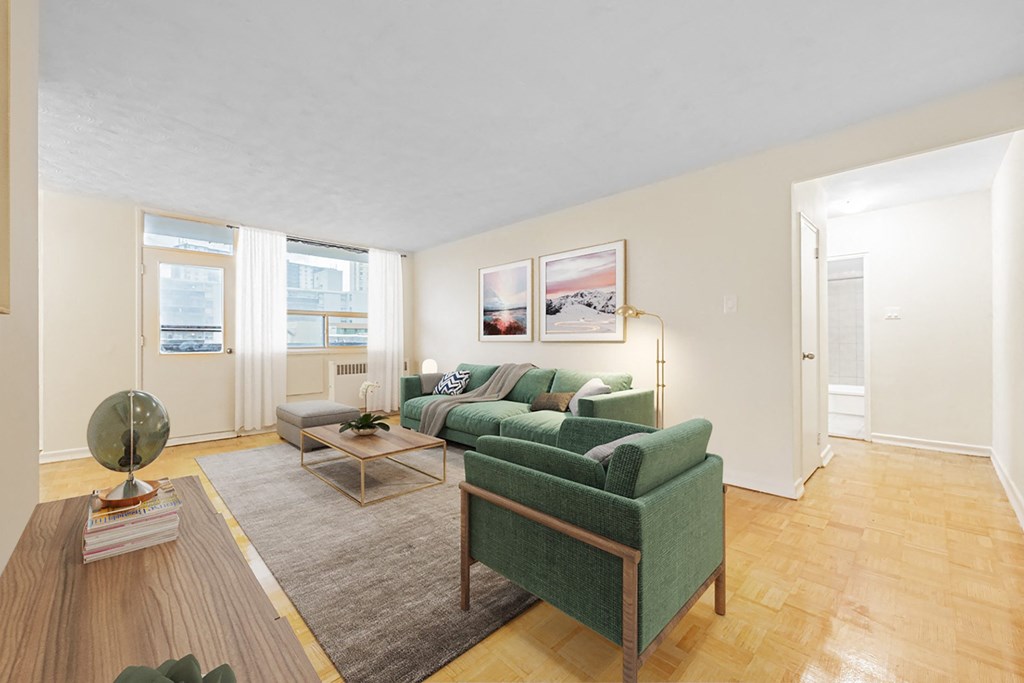 A living room with a green couch and a coffee table.