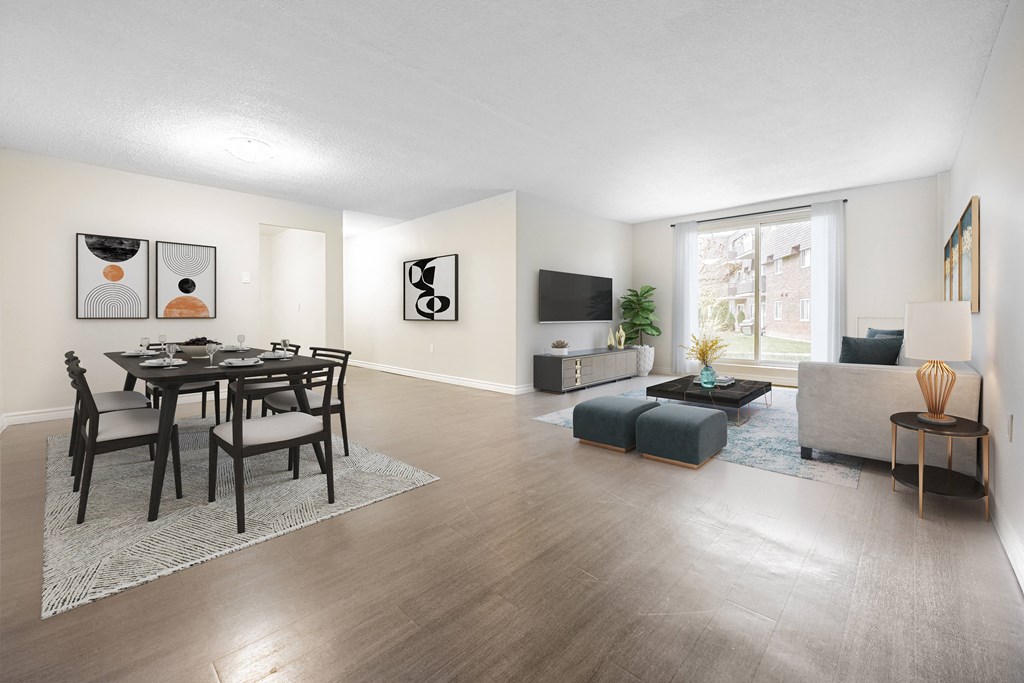A modern living room with a dining table and chairs.