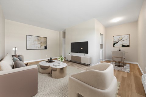 A living room with a couch, chair, and television.
