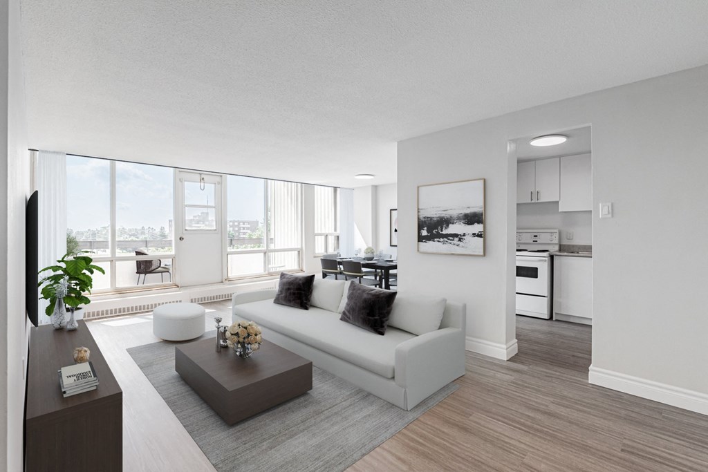 A modern living room with a large window overlooking the city.