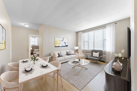 A modern living room with a dining table set for two.