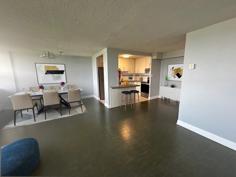 A dining area with a table set for four.